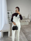 White sleeveless cardigan and trouser set