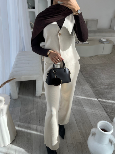 Beige sleeveless cardigan and trouser set