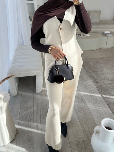 Beige sleeveless cardigan and trouser set