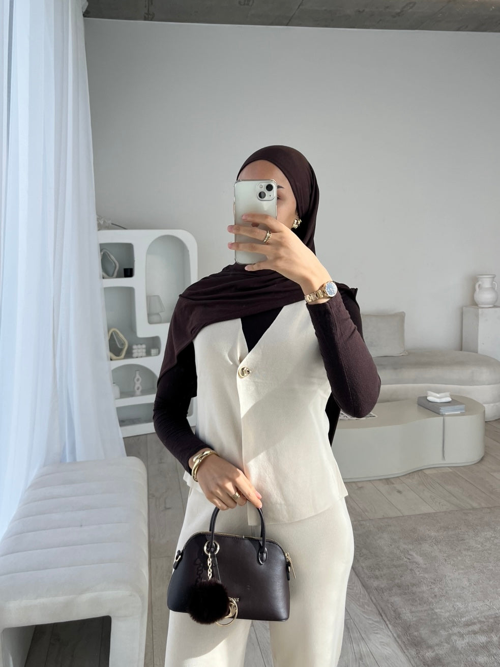 White sleeveless cardigan and trouser set