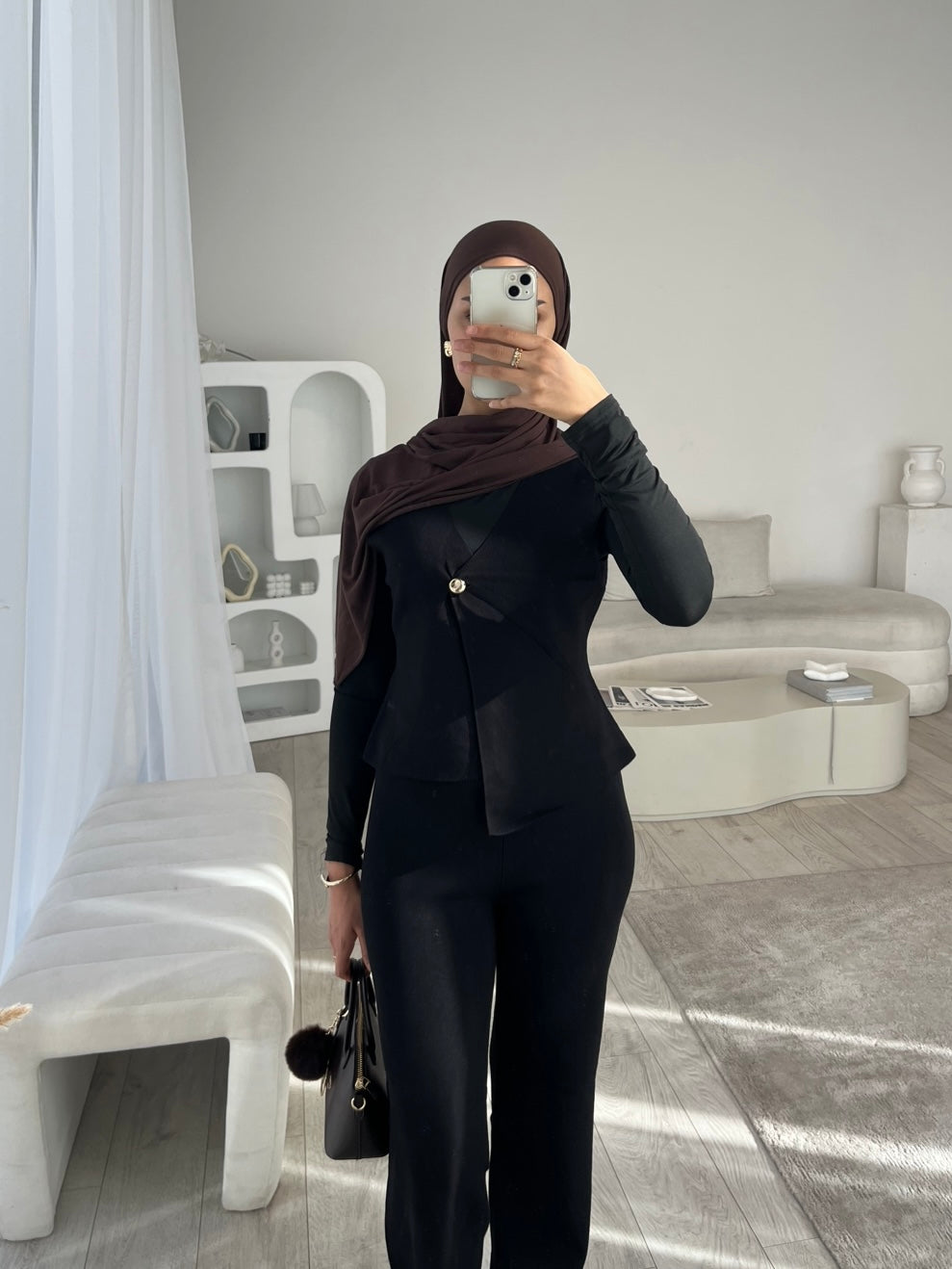 Black sleeveless cardigan and trouser set